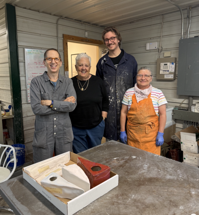 photo of 4 people, julie cowan plus 3 folks from Art Casting, a foundry in Illinois.