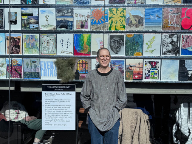 Julie Cowan in front of the artruckish exhibit at Union Pizzeria, Evanston in May 2026. Photo by Stephen Murphy.