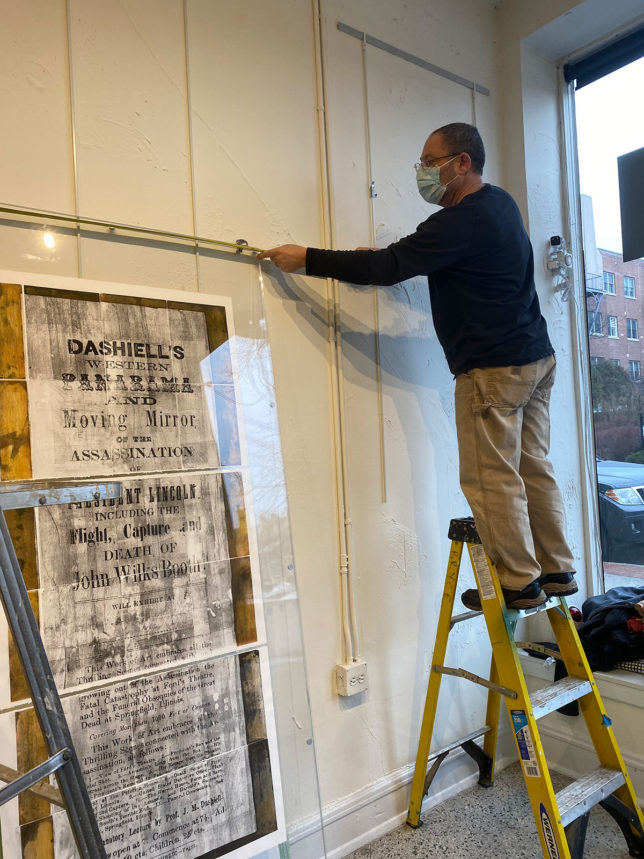 installing exhibit of Lincoln work at gallery